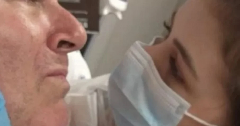 Mingau beija rosto da filha três meses após ser baleado. Foto: Reprodução de Vídeo